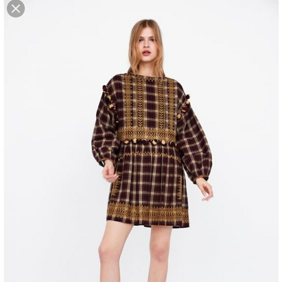 zara dress with pom poms